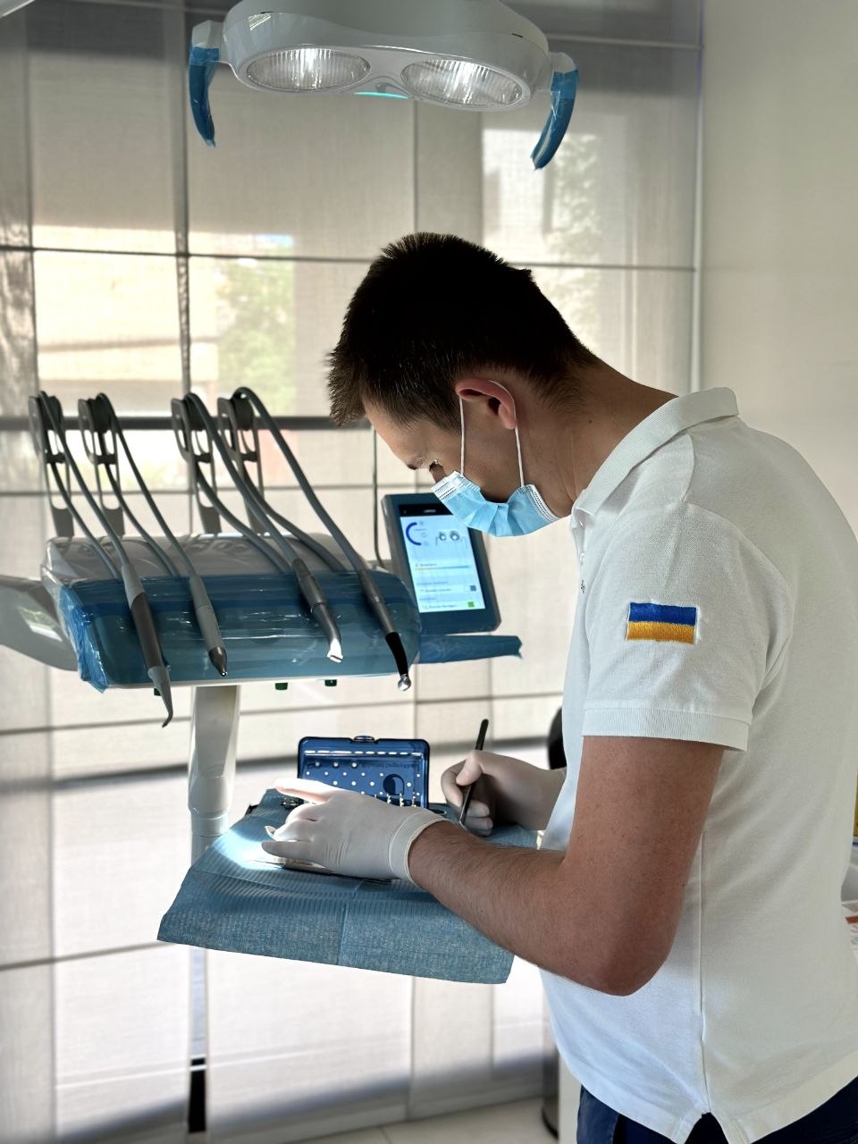 YOU-DENT dentist in white uniform